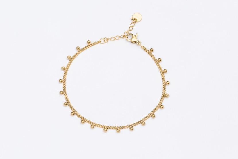 Feines gold Edelstahl Glieder Armband mit kleinen angehängten Kügelchen.