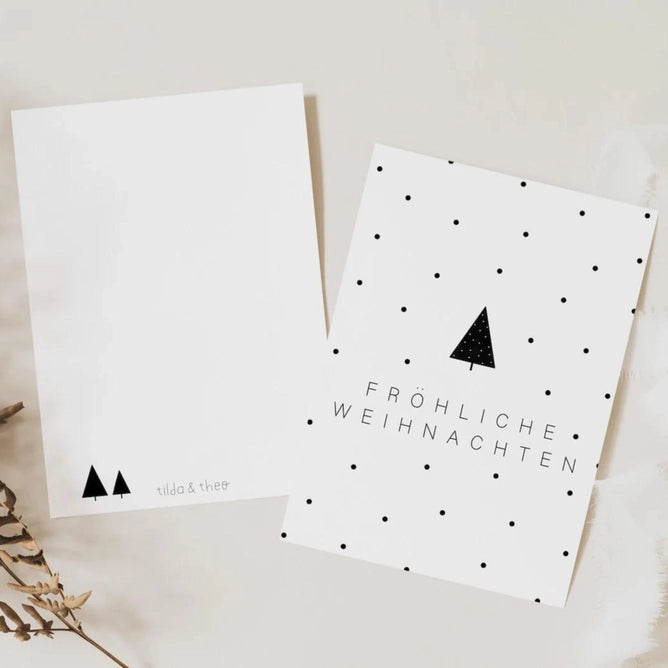 Weihnachtskarte: Fröhliche Weihnachten. Weiß mit schwarzen Punkten und Tannenbaum. Gedruckt auf Naturpapier