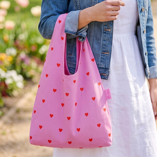 Faltbarer wasserabweisender Shopper in rosa mit roten Herzen! Für Einkäufe oder als Strandtasche verwendbar. Praktisch mit Aufbewahrungs Beutel. 