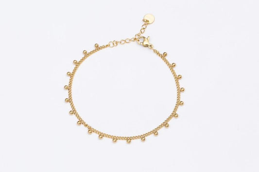 Feines gold Edelstahl Glieder Armband mit kleinen angehängten Kügelchen. 